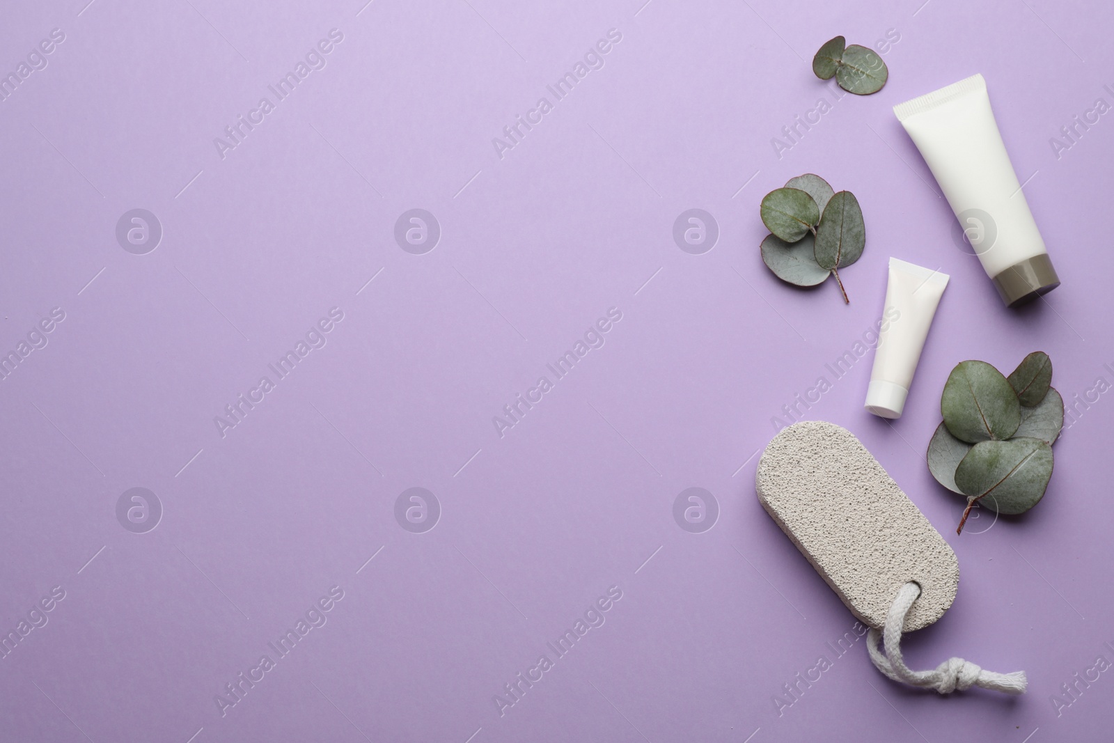 Photo of Flat lay composition with pumice stone on violet background. Space for text