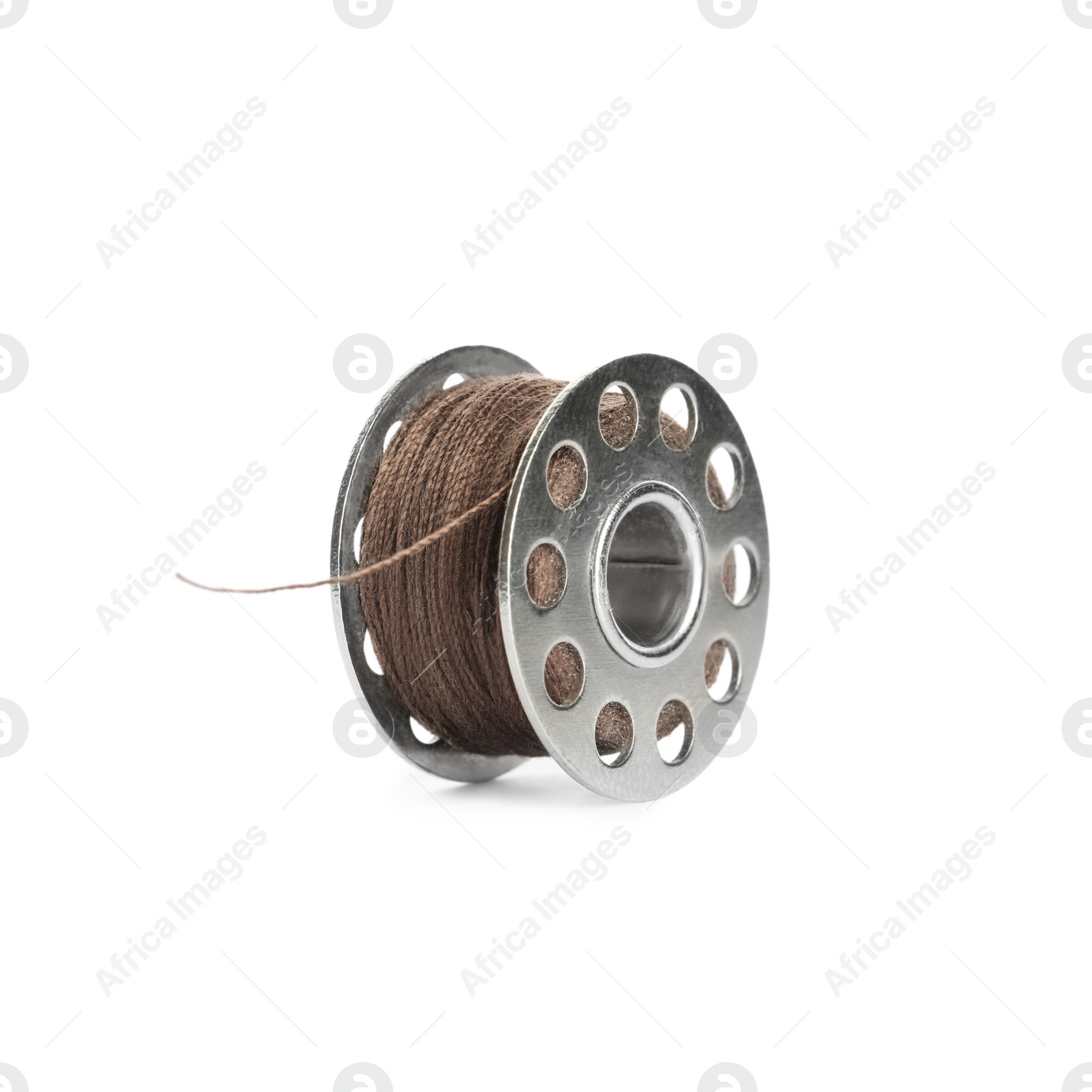 Photo of Metal spool of brown sewing thread isolated on white