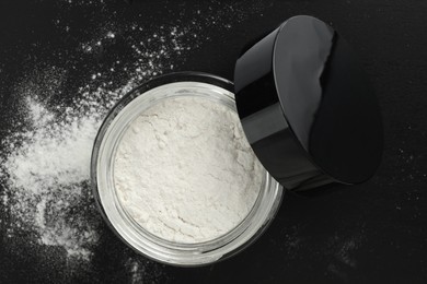 Rice loose face powder on black background, top view. Makeup product