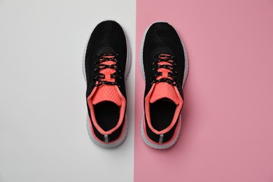 Photo of Pair of stylish sport shoes on color background, flat lay