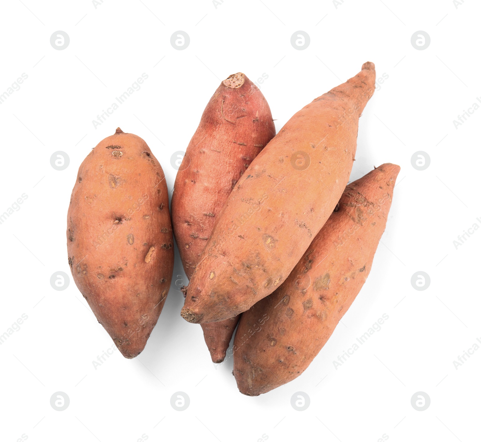 Photo of Heap of whole ripe sweet potatoes on white background, top view