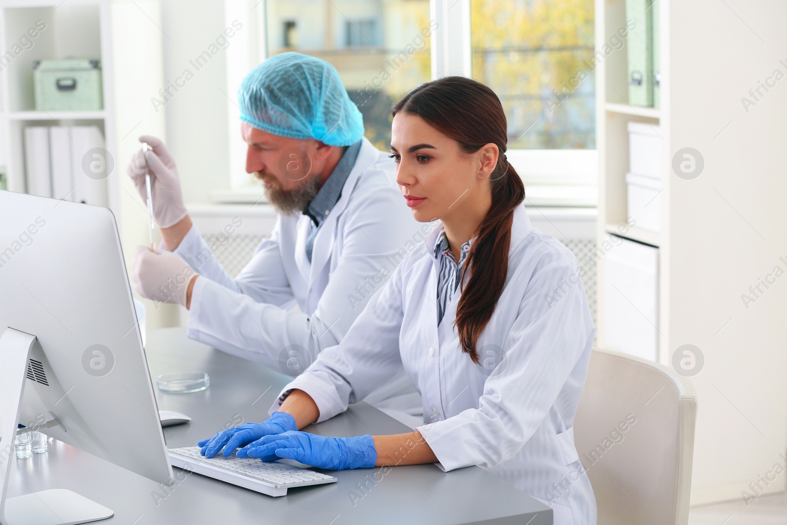 Photo of Scientists working in laboratory. Research and analysis