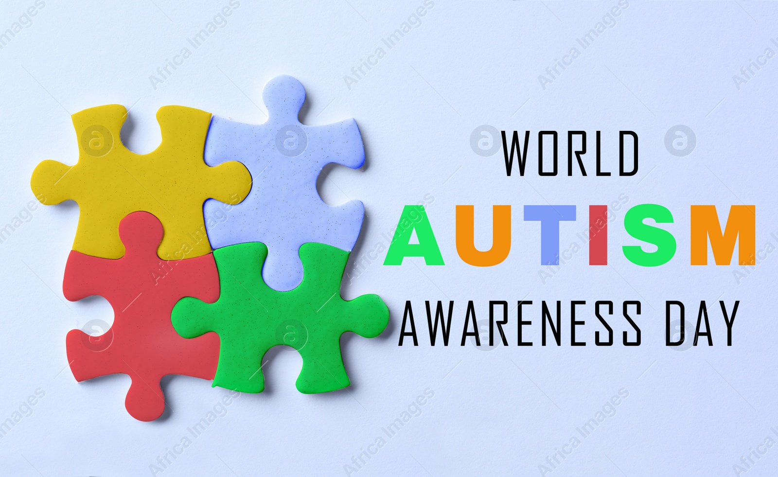 Image of World Autism Awareness Day. Colorful puzzle pieces and text on light blue background, top view