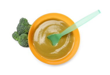 Delicious baby food, spoon and fresh broccoli in bowl isolated on white, top view