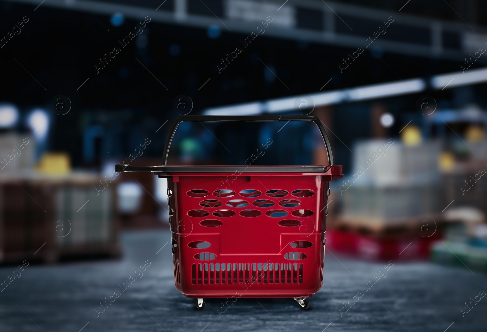 Image of Empty plastic red shopping basket in mall