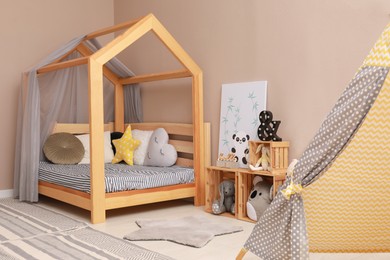 Stylish child room interior with comfortable floor bed