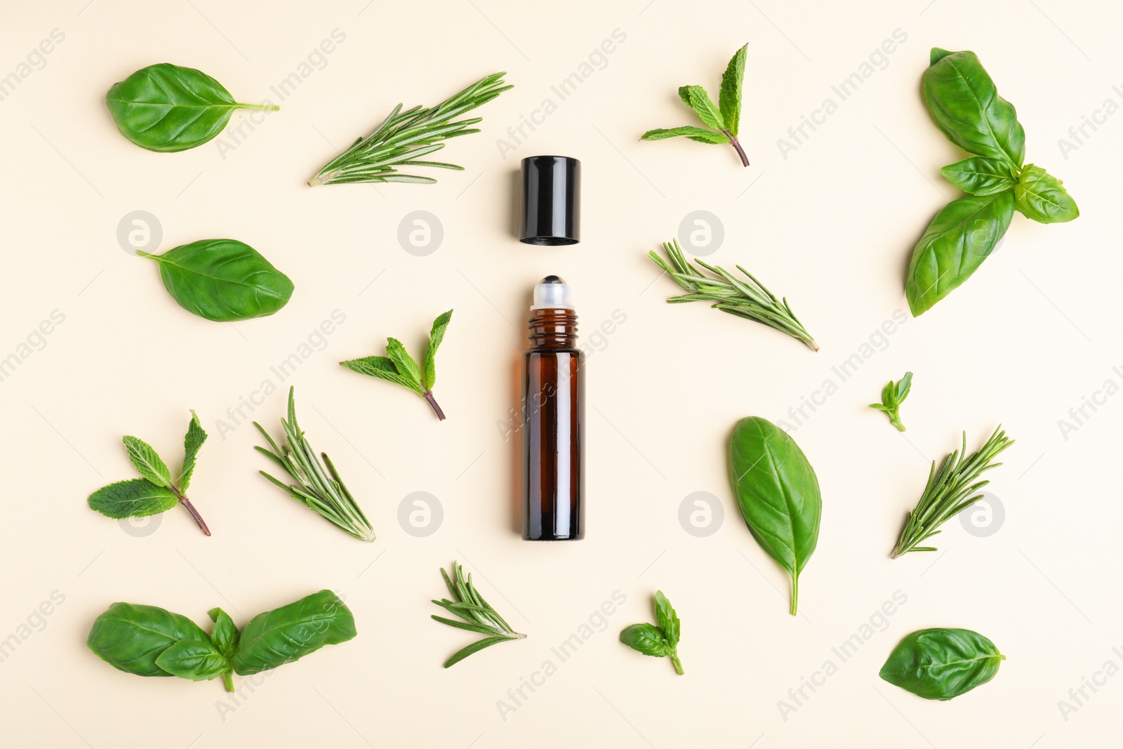 Photo of Flat lay composition with herbal essential oil on beige background