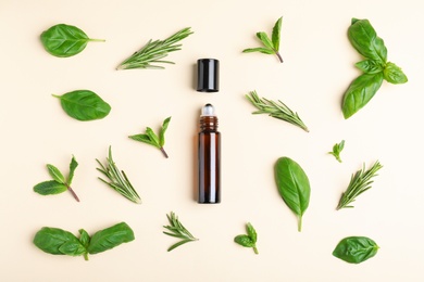 Flat lay composition with herbal essential oil on beige background
