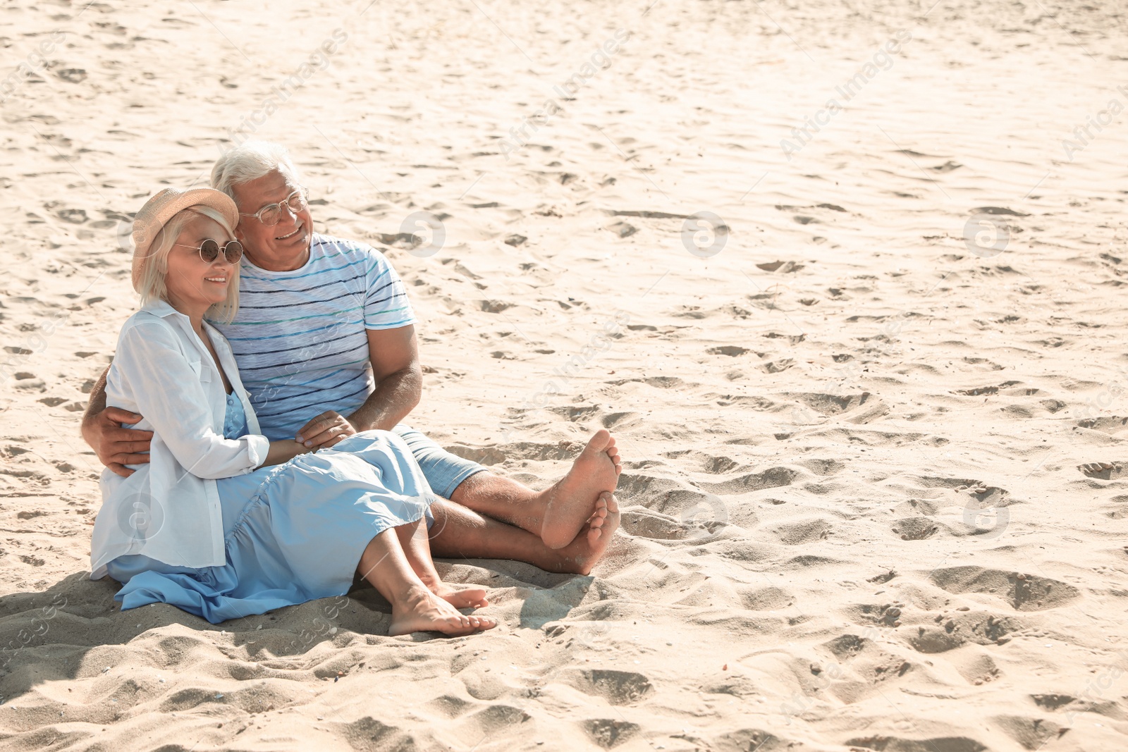 Photo of Mature couple spending time together on sea beach