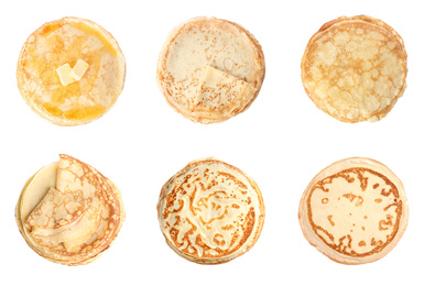 Image of Set of tasty thin pancakes on white background, top view