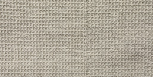 Photo of Texture of beige knitted fabric as background, top view