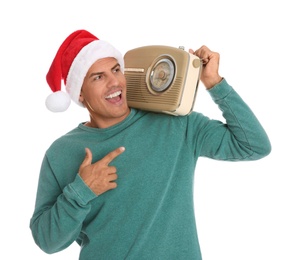 Photo of Emotional man with vintage radio on white background. Christmas music