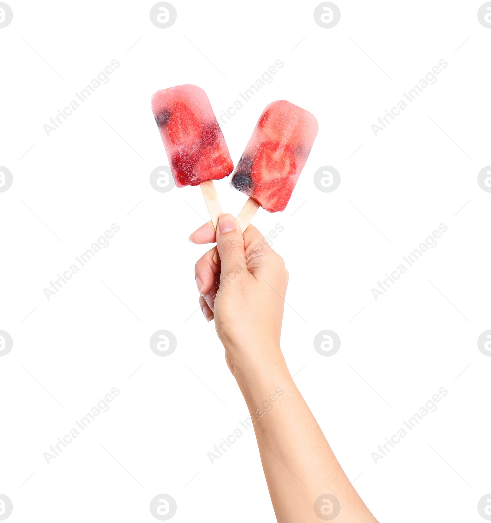 Photo of Woman holding berry popsicles on white background, closeup