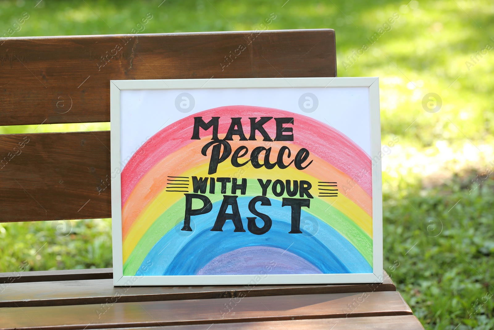 Photo of Phrase Make Peace With Your Past written on poster outdoors