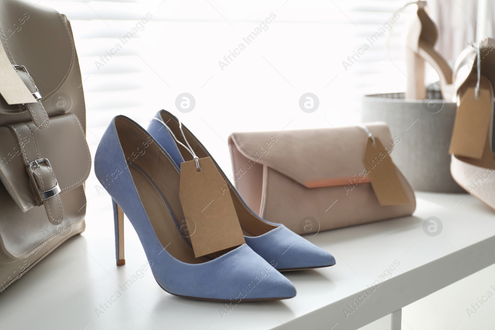 Photo of Women's high heel shoes and accessories in modern clothing boutique, space for text