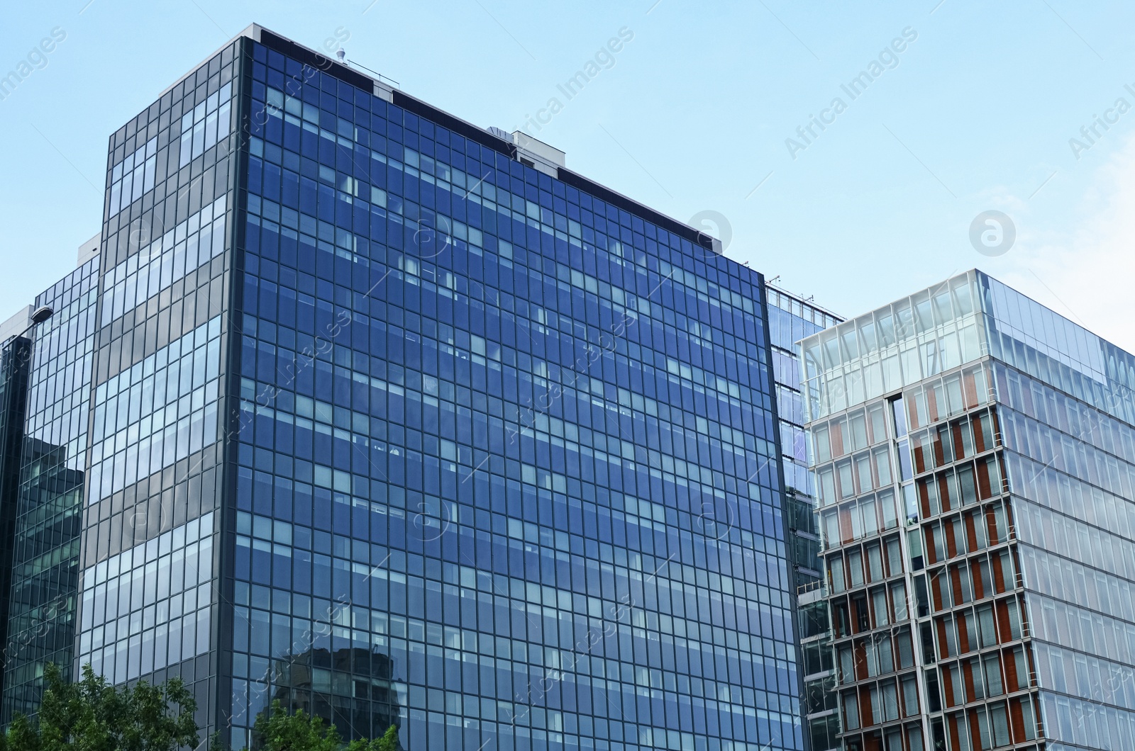 Photo of Exterior of beautiful modern skyscrapers against blue sky