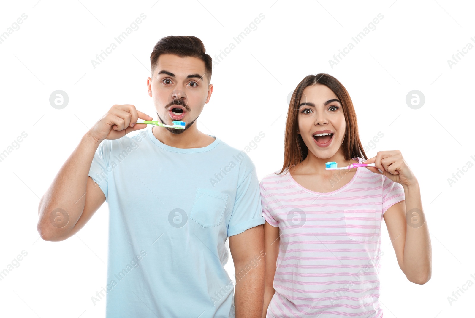 Photo of Happy couple brushing teeth on white background