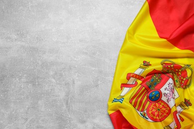Photo of Flag of Spain on light gray textured background, top view. Space for text