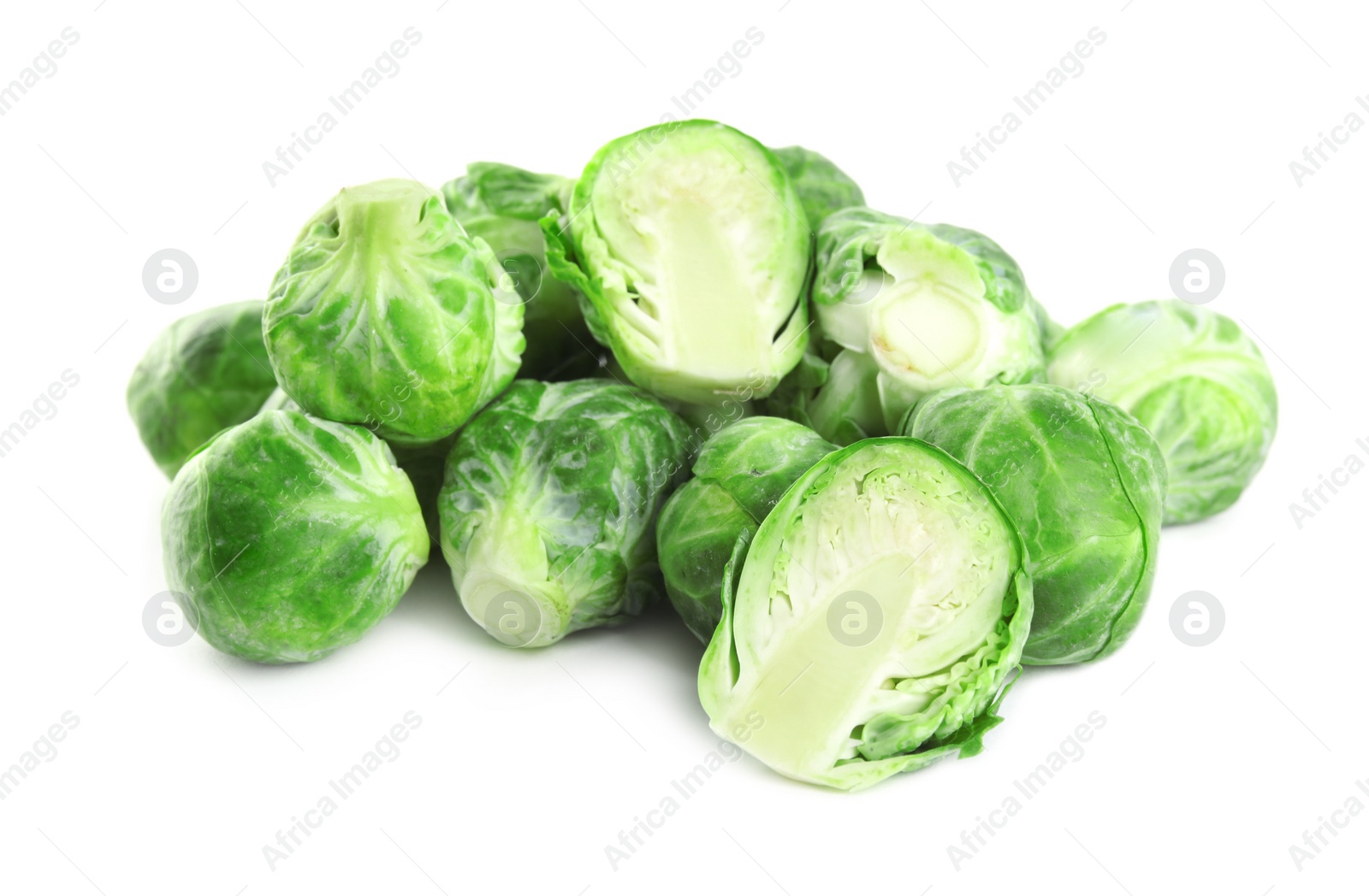 Photo of Pile of fresh Brussels sprouts isolated on white