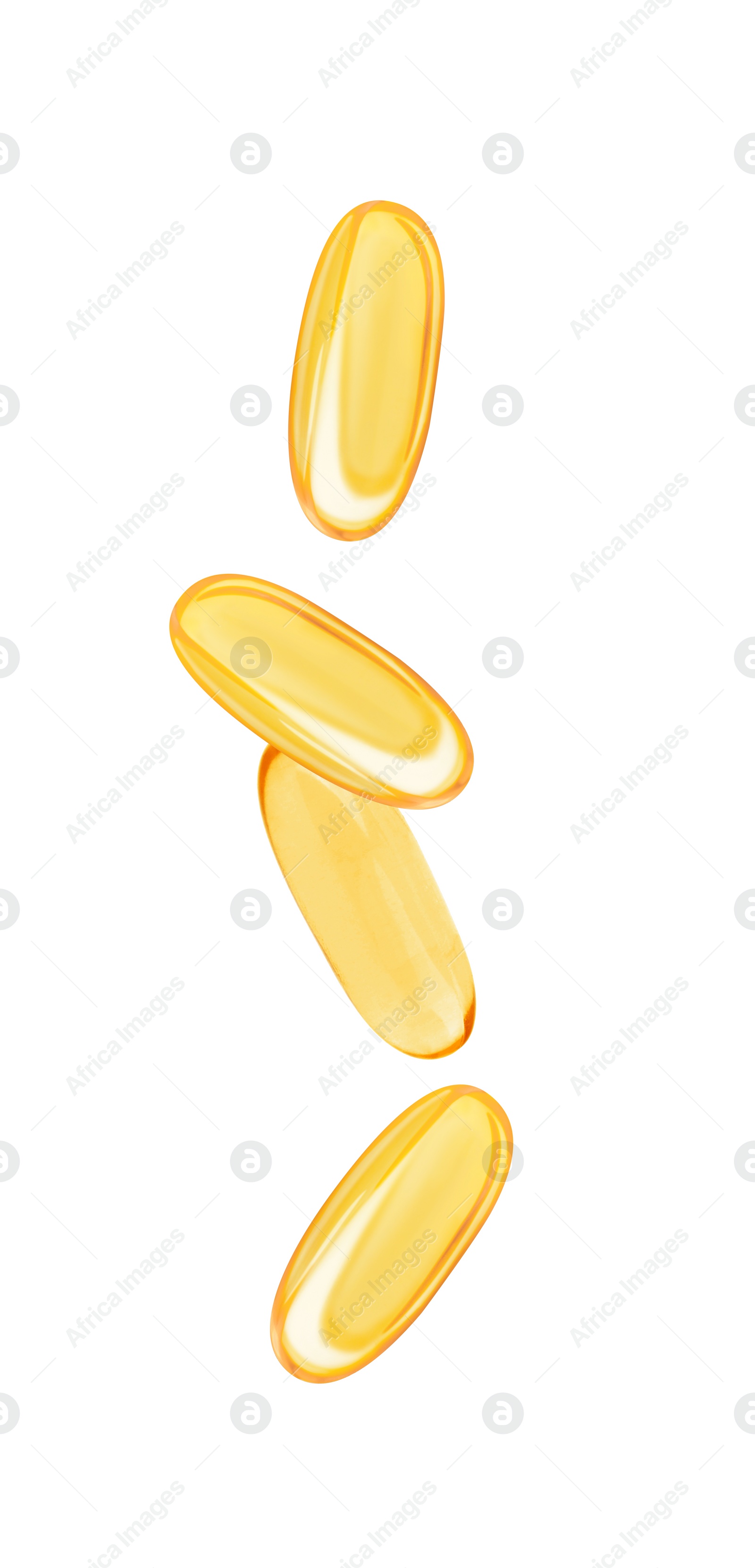 Image of Vitamin. Softgel capsules falling on white background