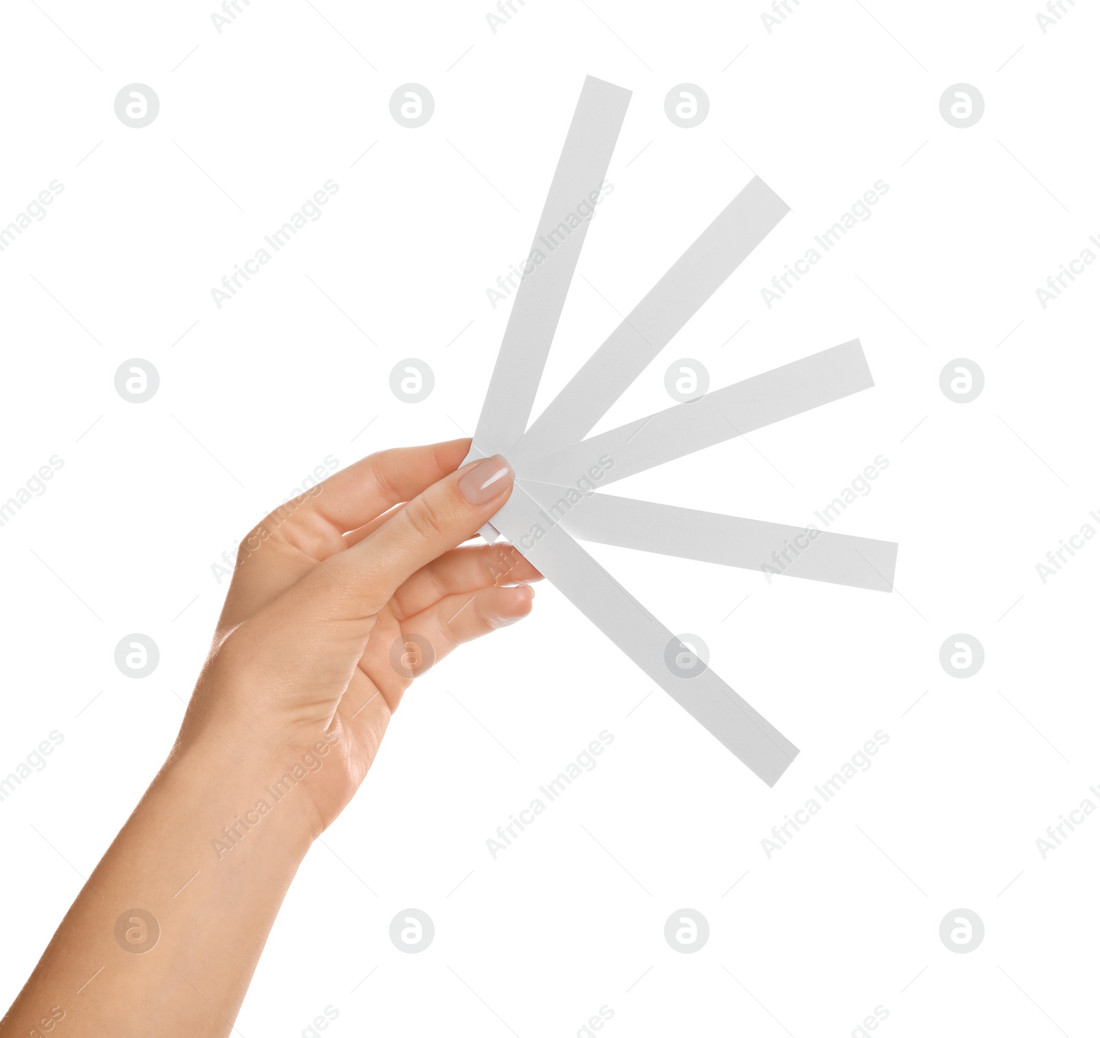 Photo of Woman holding perfume testing strips on white background, closeup