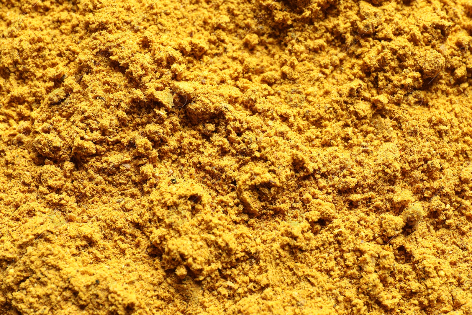 Photo of Dry curry powder as background, top view