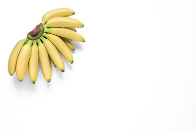 Photo of Bunch of ripe baby bananas on white background, top view
