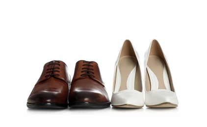 Photo of Classic wedding shoes for bride and groom on white background