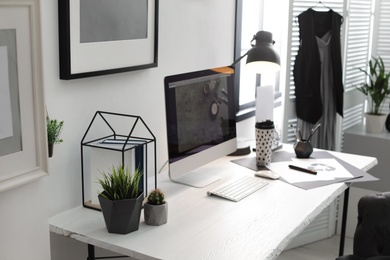 Photo of Stylish workplace with modern computer on desk