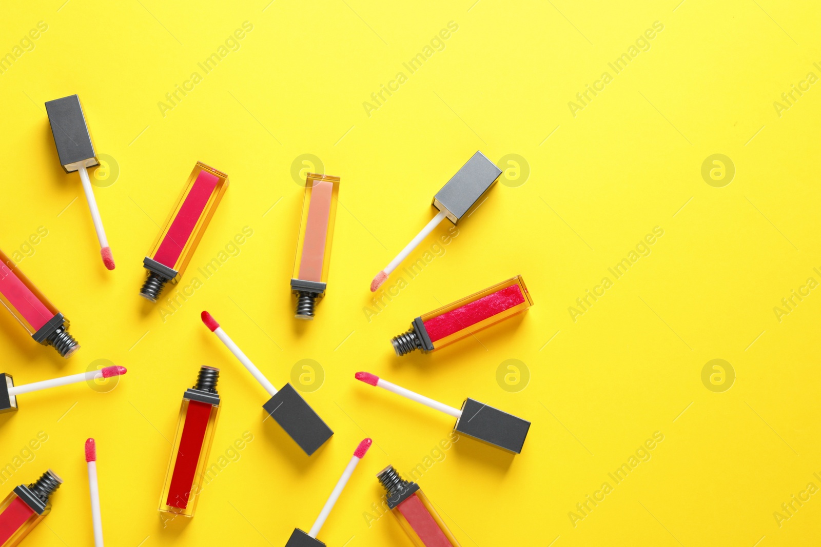 Photo of Composition of lipsticks on color background, flat lay. Space for text