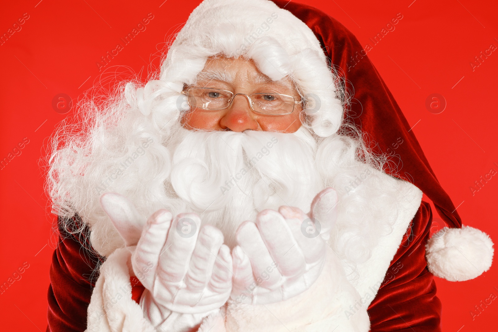 Photo of Happy authentic Santa Claus on red background