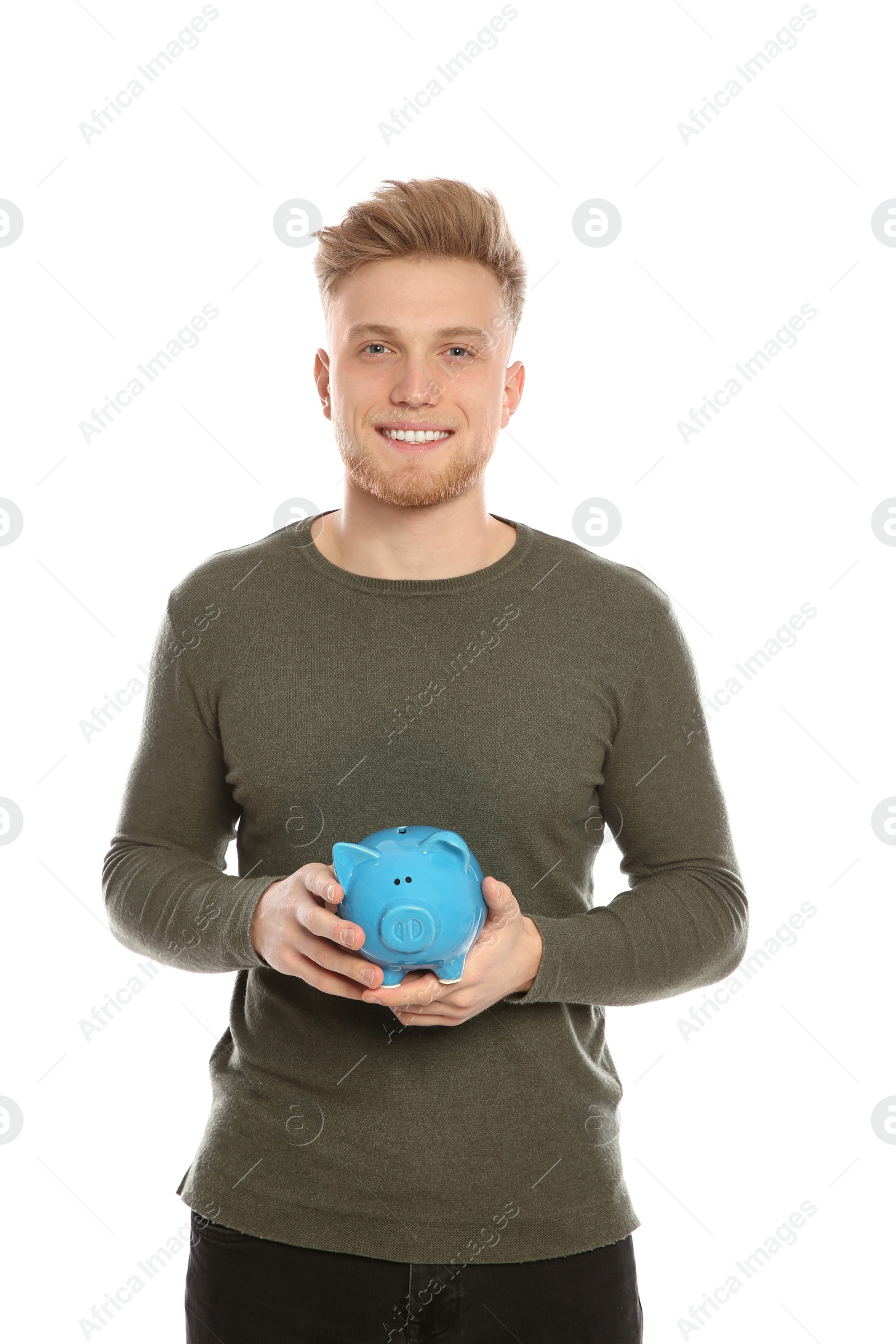 Photo of Young man with piggy bank on white background