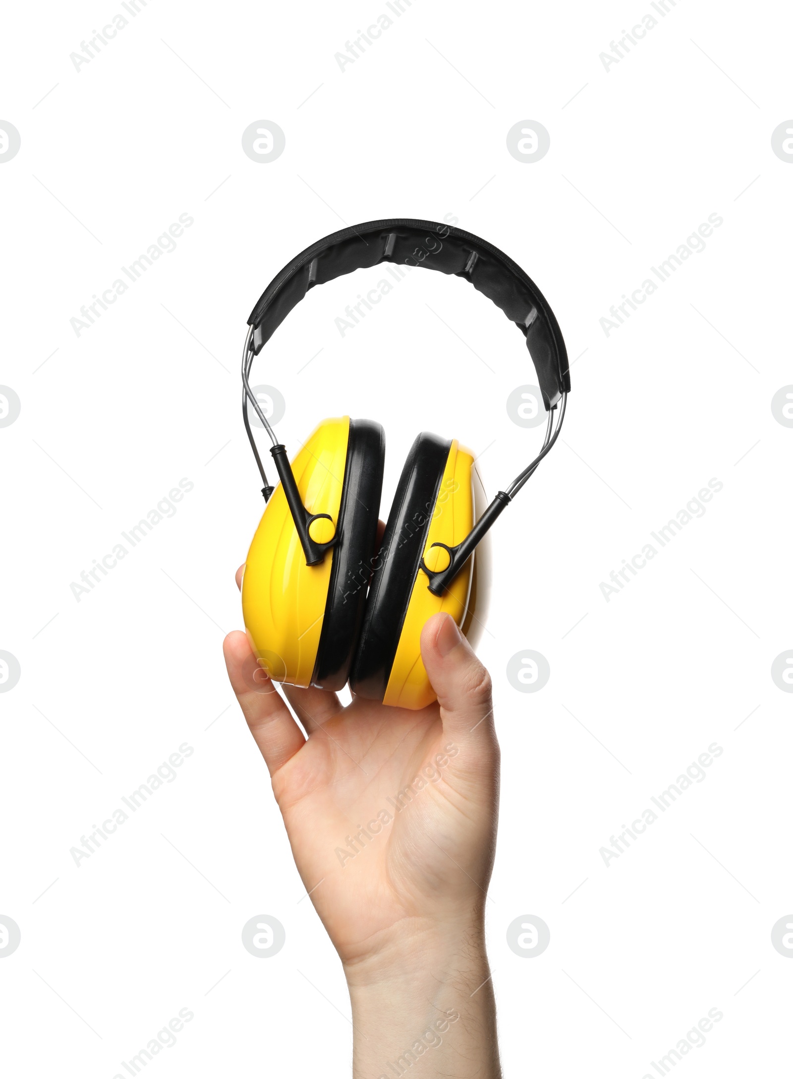 Photo of Man holding protective headphones isolated on white, closeup