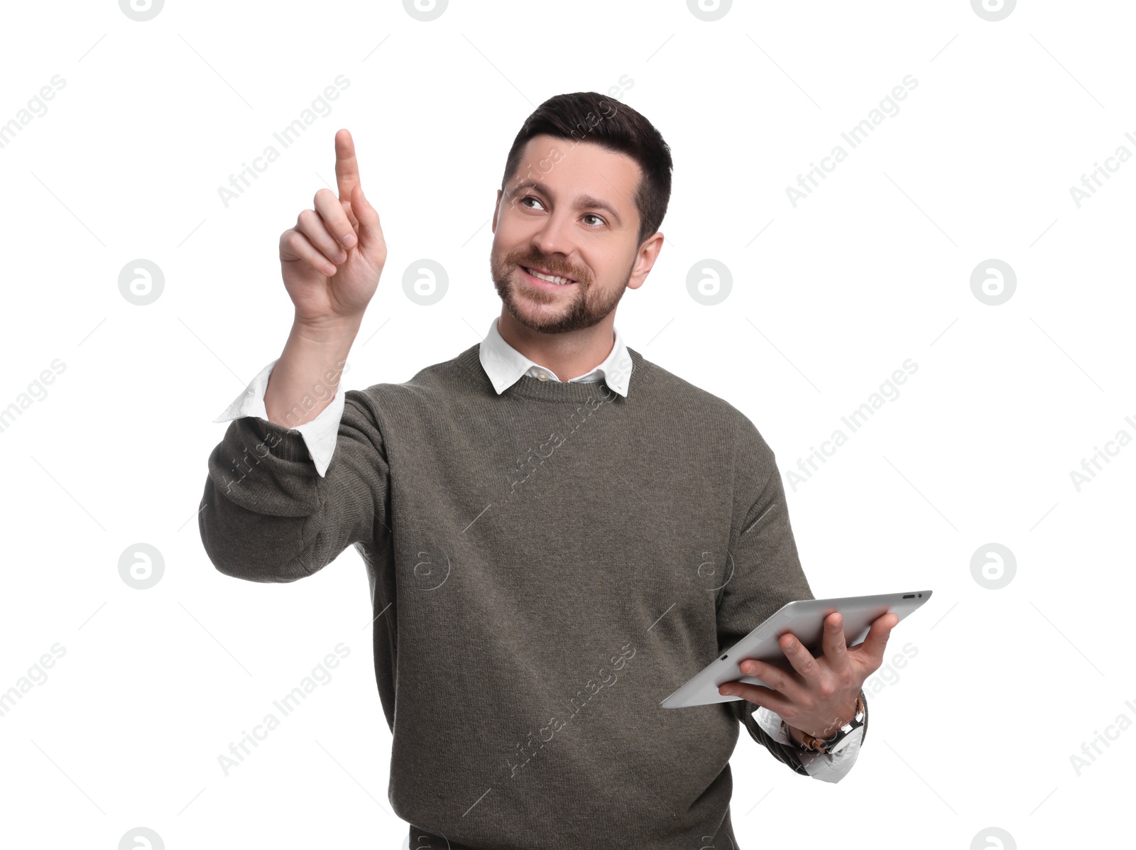 Photo of Handsome bearded businessman with tablet pointing at something on white background