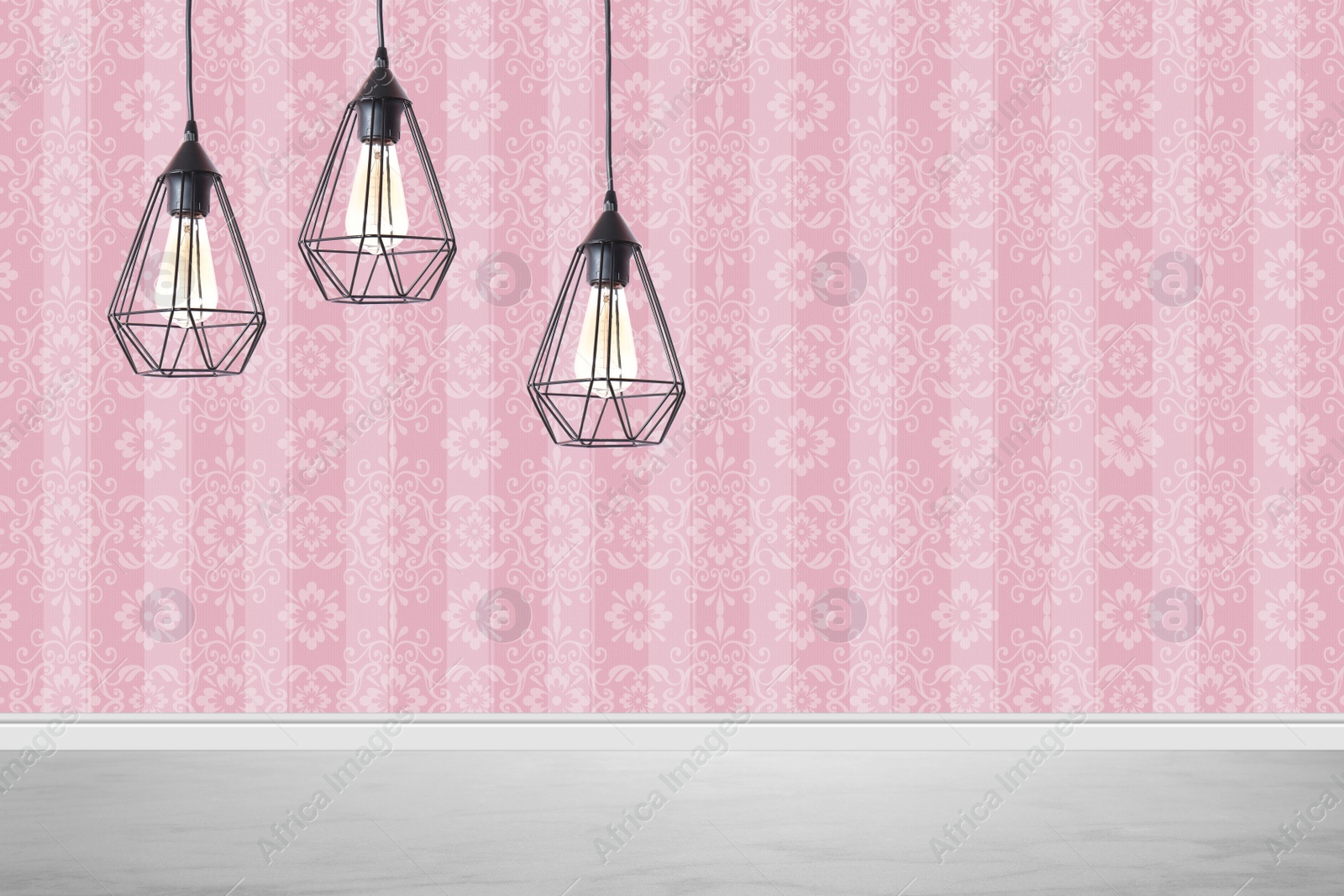 Image of Stylish pendant lamps hanging near pink wall in room