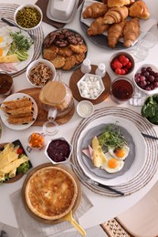 Photo of Many different dishes served on buffet table for brunch, flat lay