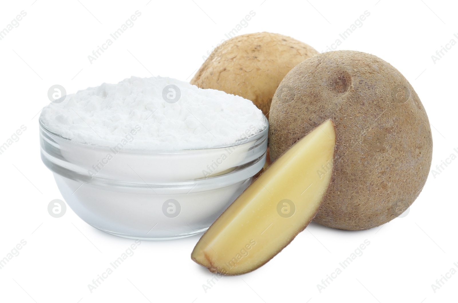 Photo of Glass bowl of starch and fresh raw potatoes on white background