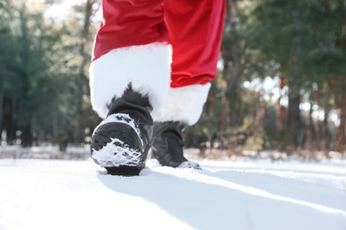Photo of Authentic Santa Claus walking outdoors, focus on legs