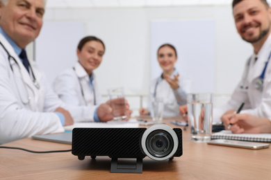 Photo of Video projector on table during medical conference