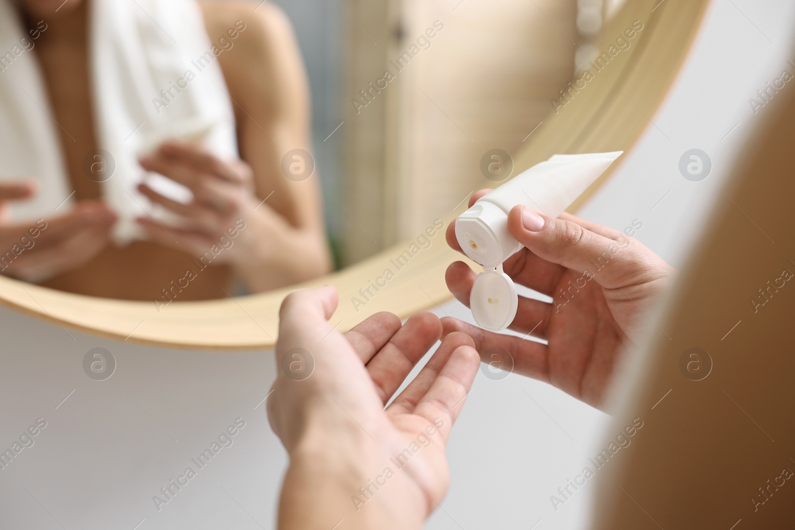 Photo of Man with moisturizing cream indoors, closeup view