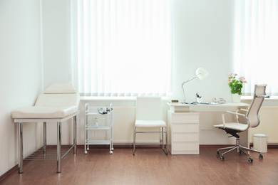 Photo of Interior of modern medical office. Doctor's workplace