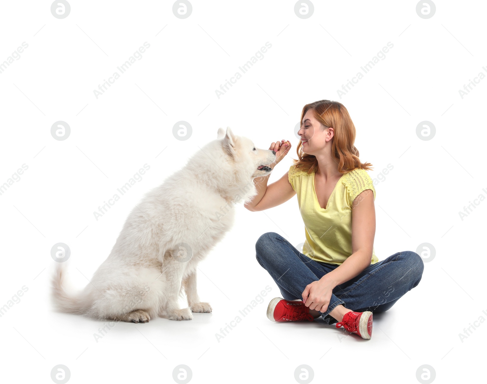 Photo of Beautiful woman with her cute dog on white background