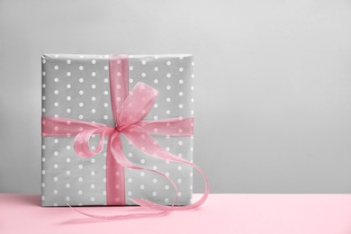 Photo of Elegant gift box for Mother's Day on table