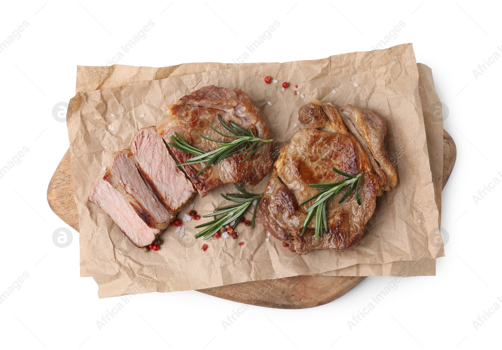 Photo of Pieces of delicious fried meat with rosemary and spices isolated on white, top view