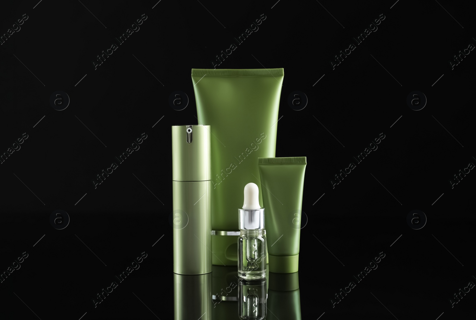 Photo of Set of cosmetic products on black background