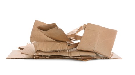 Photo of Pieces of cardboard on white background. Recycling rubbish