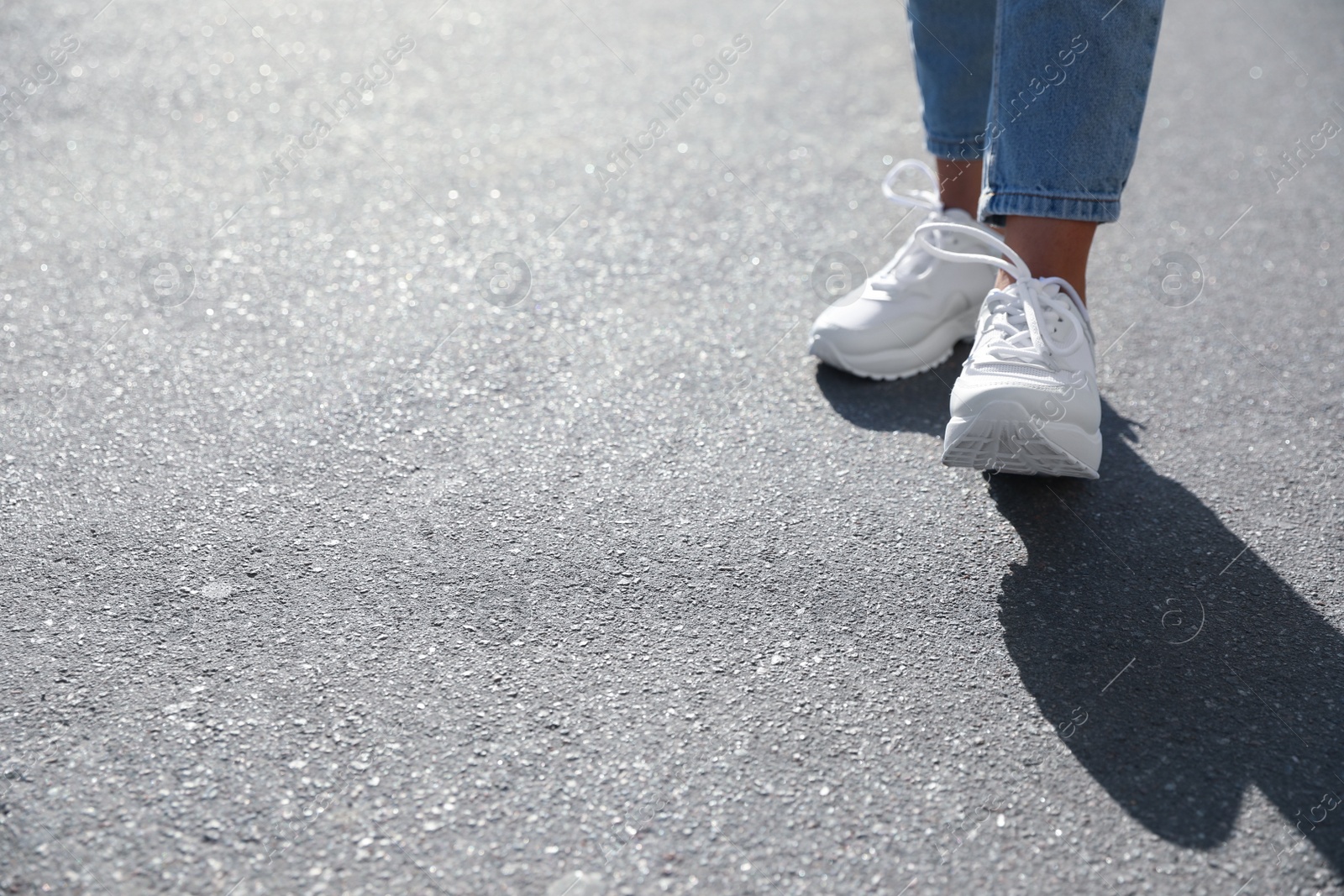 Photo of Woman walking outdoors, closeup with space for text. Choosing way concept.