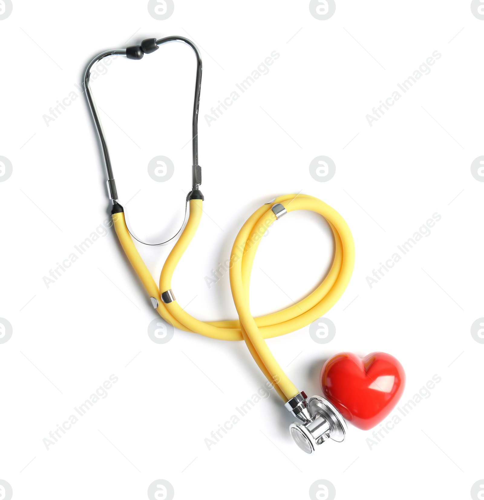 Photo of Stethoscope and heart model on light background, top view. Medical equipment