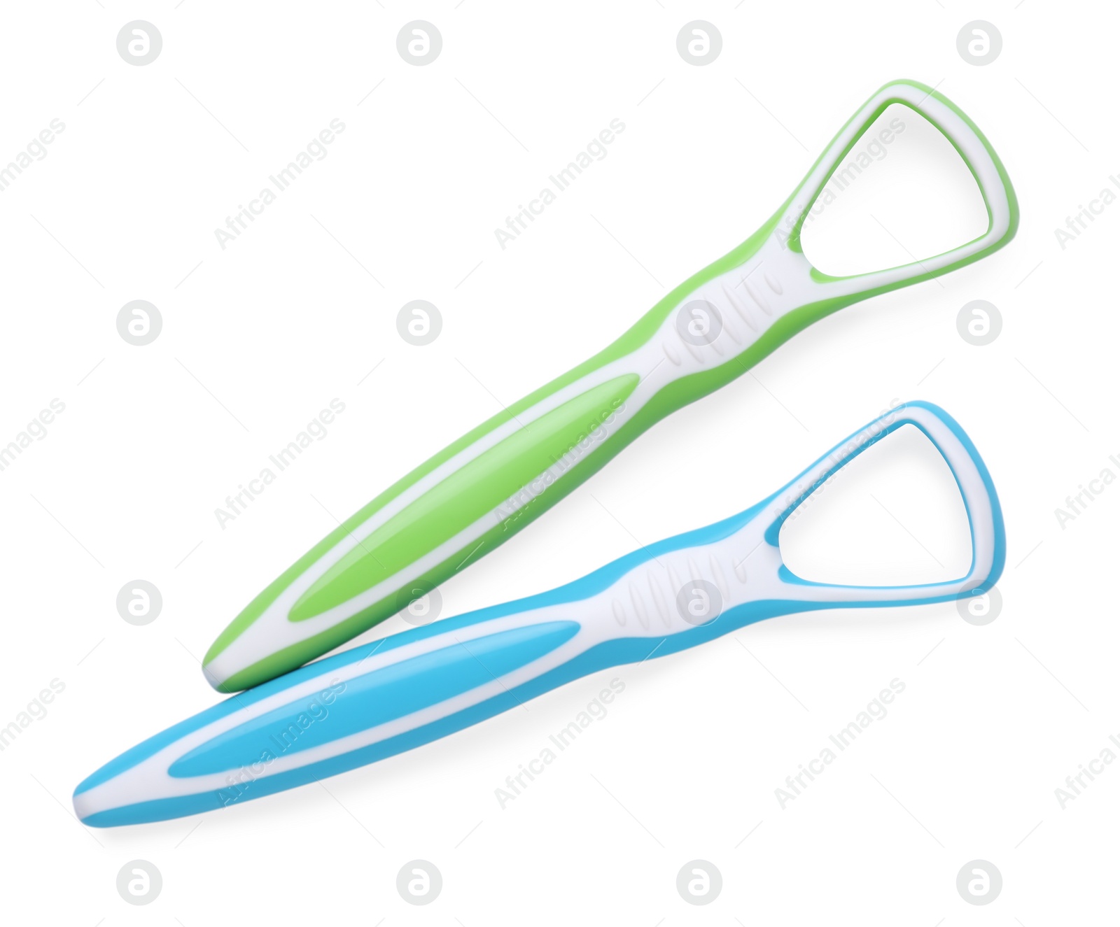 Photo of Tongue cleaners isolated on white, top view. Dental care