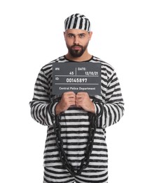 Photo of Prisoner with chained hands holding mugshot letter board on white background